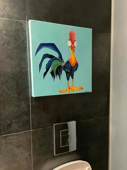 A fun commission piece featuring Heihei, the rooster from Disney's 'Moana'. It's a quirky and colorful painting that adds a touch of humor to the client's bathroom wall.