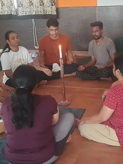 We also practice yogic kriyas for mental clarity. This is Jyoti Trataka, a candle-gazing meditation that improves focus, calms the mind, and is a powerful technique for relieving anxiety. It is a beautiful way to connect with your inner light.