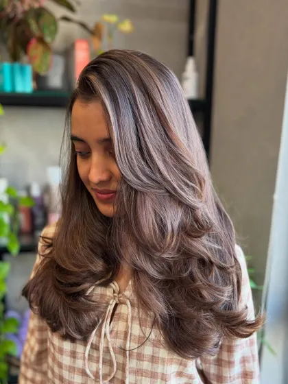 A side profile of the Frosted Hazelnut look, showing how the layers and color work together to create volume and movement.