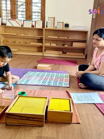 A student works with the hundred board and golden bead materials, deepening his understanding of the decimal system. Our hands-on math materials make abstract concepts clear and accessible.