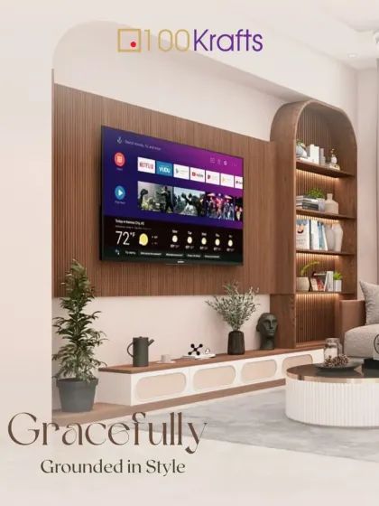 Gracefully grounded in style, this living room features a TV unit with curved shelving and a low-profile console, creating a soft, organic, and modern look.