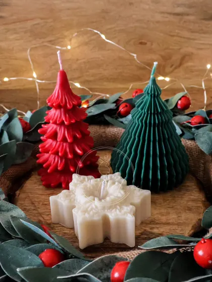 Another festive Christmas candle set, with red and green trees and a snowflake.