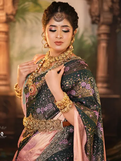 A serene portrait capturing the complete bridal look, from the maang tikka to the perfectly draped saree.