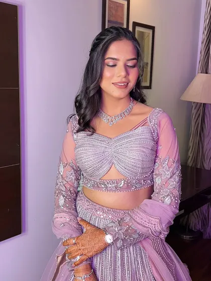 A close-up of Anu's serene expression. The soft pink tones on her eyes and cheeks give her a youthful and romantic glow.