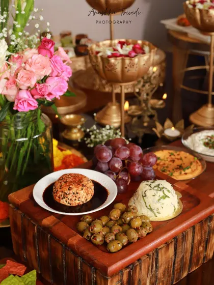 A beautifully styled cheese and dips platter from a Diwali party. The moody lighting and elegant presentation highlight the sophisticated side of festive catering.