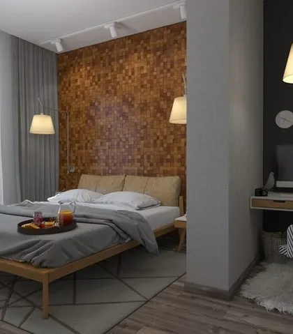 A cozy bedroom design featuring a unique wood mosaic accent wall and a dedicated workspace, perfect for a compact apartment or guest room.