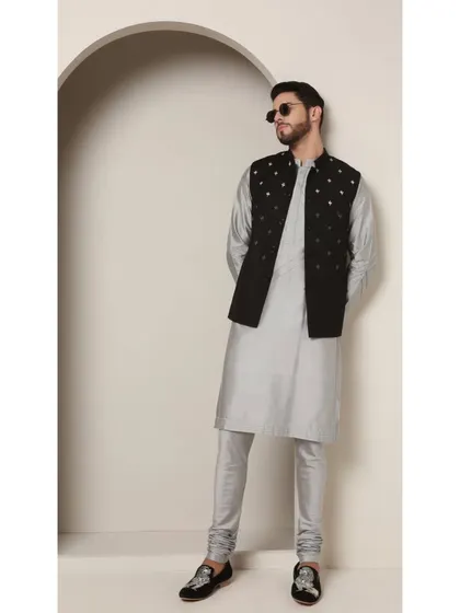 The 'Shoorveer' set styled with sunglasses for a modern, confident look. This shows how my traditional-wear can be adapted for a contemporary, fashion-forward client.