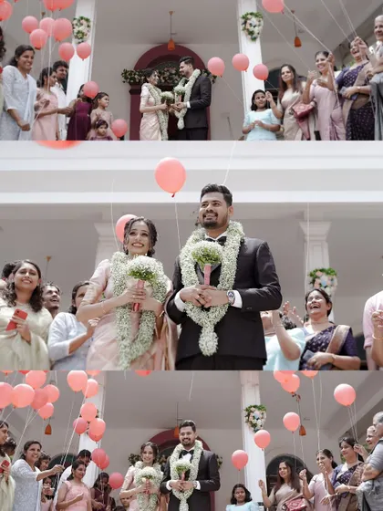 The couple stands amidst a joyful crowd and floating balloons, a perfect picture of celebration after their Christian wedding.