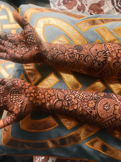 Bride Tasmiya's full bridal henna. The design is a beautiful mix of floral and geometric patterns, creating a rich and detailed look.