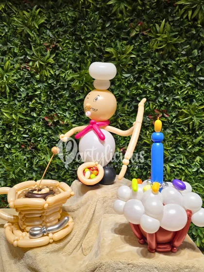 The full chef-themed balloon sculpture set, featuring a little chef, a cup of coffee, and a birthday cupcake, all crafted from balloons.