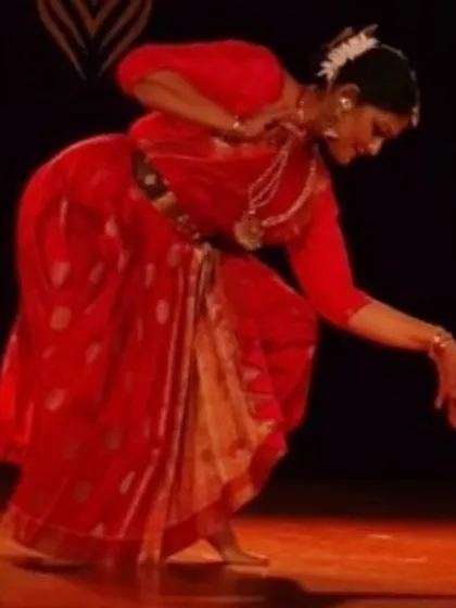 A graceful pose from my recital in Chennai. The traditional red costume and temple jewelry are an integral part of the visual aesthetic of a classical Bharatanatyam performance.