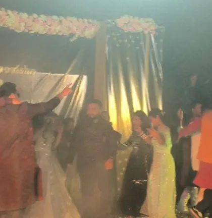 A wedding for a couple from Bihar, with smoke and confetti adding to the celebration.