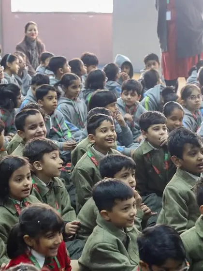 A room full of smiling, engaged young learners at Suncity School. Puppet shows are a real attendance magnet and a guaranteed way to fill a room with laughter and enthusiasm.
