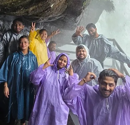 Making our way behind a waterfall in Wayanad. These are the moments of pure magic that my trips are all about.