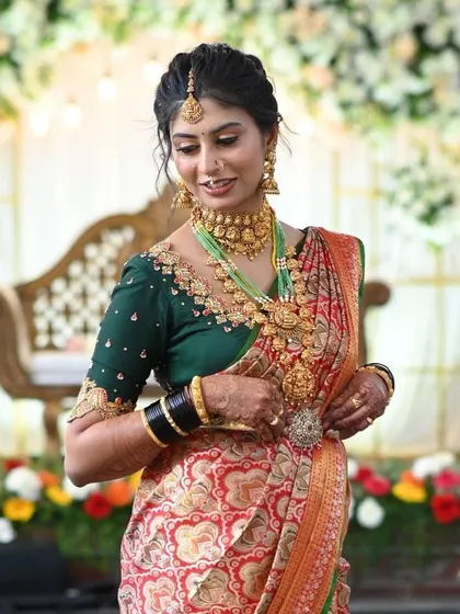Another beautiful shot of the bride, showcasing the perfect harmony between her saree, jewelry, and our custom-designed blouse.