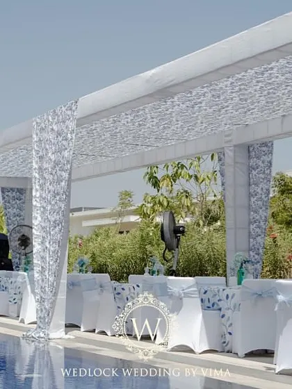 An overview of a beautiful brunch pool party setup. We arranged elegant white canopies by the poolside to provide shade for guests, creating a comfortable and stylish lounge area.
