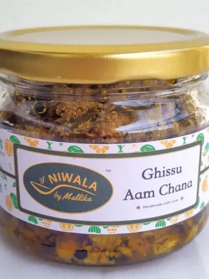A jar of my Ghissu Aam Chana pickle. This unique creation combines grated raw mango with chickpeas for a wonderful texture and taste that has become a favourite among my customers.