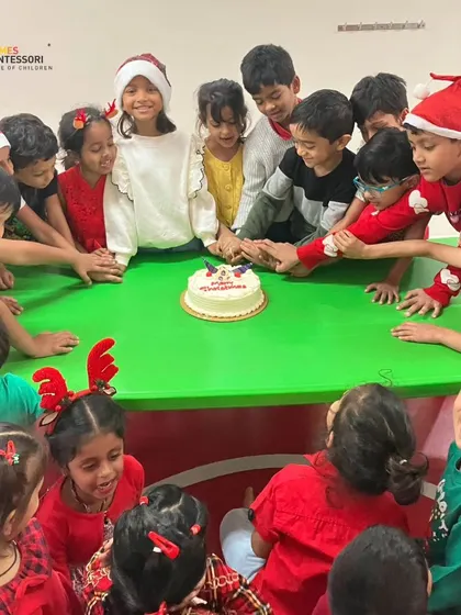 A Christmas celebration, with children gathered around a cake, sharing a moment of festive joy and community.