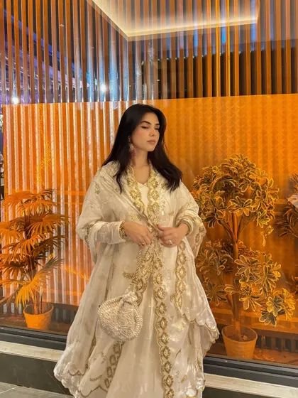 Posing to showcase the full silhouette and design of this gorgeous ethnic wear piece.