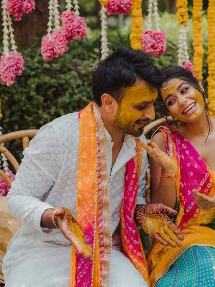 The joy of a Haldi ceremony is infectious. We love creating bright, happy spaces like this one with marigold and tuberose garlands for these celebrations.