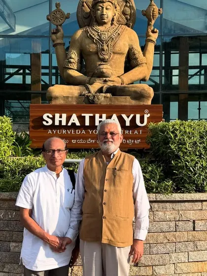 Our team with Dr. G.G. Gangadharan in front of the Lord Dhanvantari statue. This image symbolizes our shared dedication to the ancient science of Ayurveda.