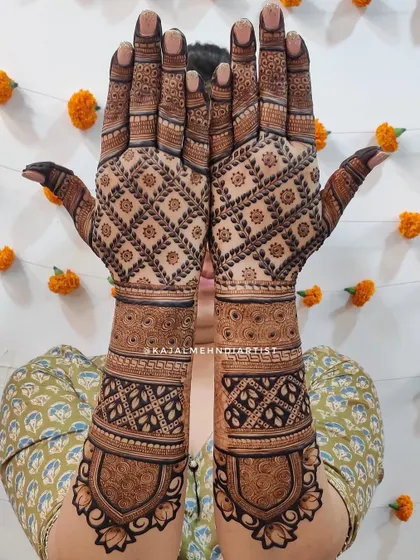 For the bride who loves a full, rich look. This heavy backhand design is filled with intricate geometric and floral patterns, covering the entire back of the hands and wrists.