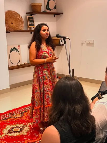 A performer sharing her story with our tribe. Our open mics are more than just events; they are a support system where artists can be vulnerable and feel heard.