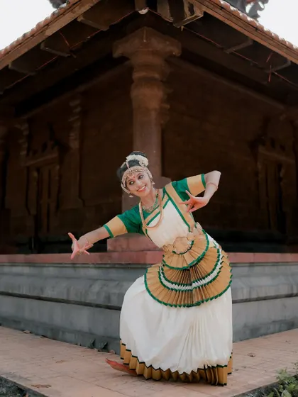 A duplicate of image 62, this shot captures a dancer in mid-pose, showcasing the dynamic movement and expressive nature of Mohiniyattam.