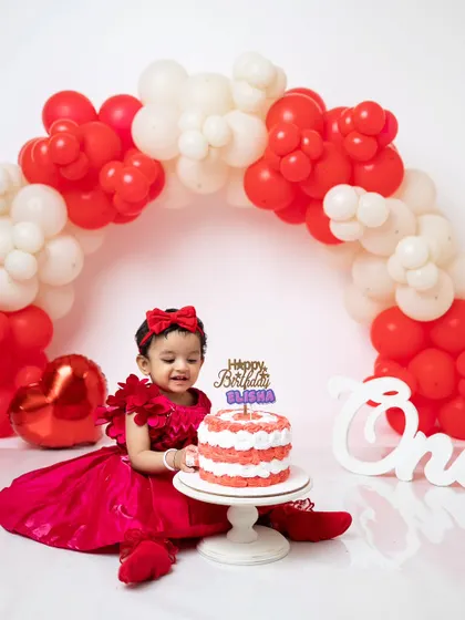 A happy smile as she enjoys her first birthday cake. I focus on capturing these expressions of pure joy.