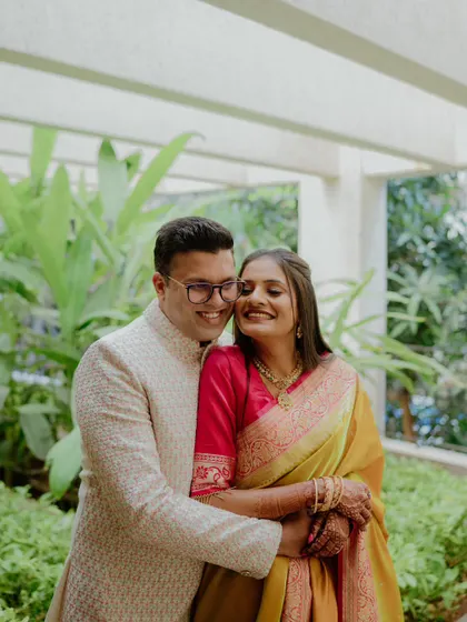 A sweet and happy photo of a couple in a loving embrace. Her smile and his gentle hold create a portrait filled with warmth and affection, perfect for their pre-wedding album.