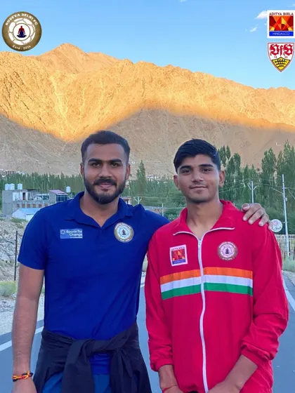 A coach with his arm around a young player in Ladakh. Our coaching philosophy is built on mentorship, guidance, and building strong, supportive relationships with our players.