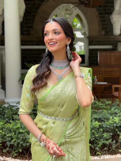 A joyful portrait of our South Indian bride. Her makeup is kept fresh and radiant, with a focus on a dewy base that looks like second skin.
