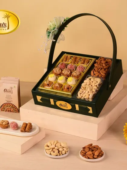 A sleek and modern dark green hamper basket. This design is perfect for those who appreciate a contemporary aesthetic, filled with a delicious assortment of my sweets and nuts.