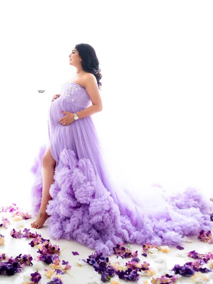 A full-length view of a dramatic ruffled gown against a clean white background. You'll learn how to make the outfit a central part of the story.