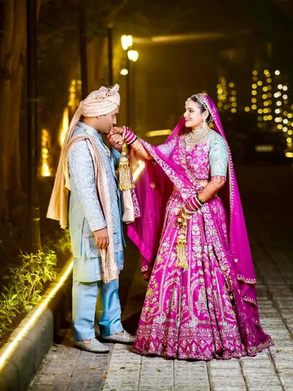 A sweet moment where the bride holds the groom's hand.