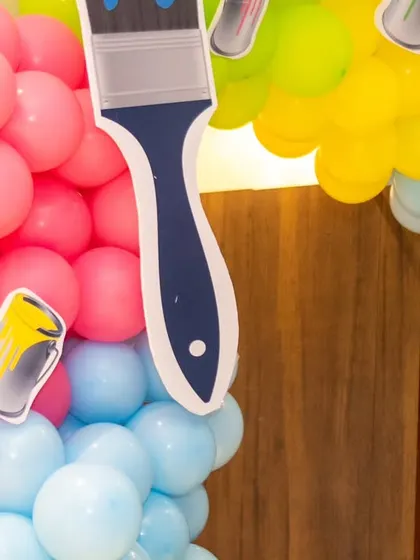 Detail shot of the colorful balloon garland with paintbrush cutouts for our Art & Paint theme.