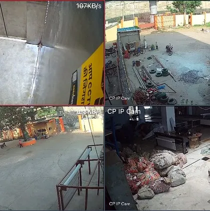 A four-camera IP feed from a large industrial site, showing a tanker truck, outdoor yard, and raw material storage. IP cameras provide superior clarity for large, open spaces.