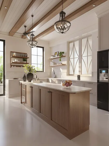 The kitchen is the heart of the home, a place for gathering. We designed this spacious kitchen around a large central island to serve as a hub for family life, using creamy white cabinetry, warm wood tones, and abundant natural light to make it feel open and inviting.