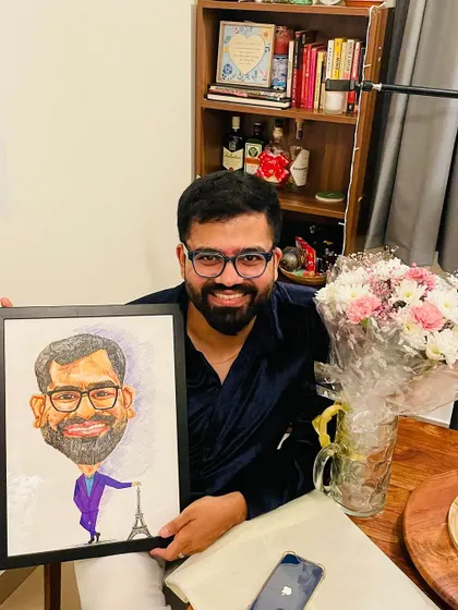 A happy client with his framed caricature. It’s always wonderful to see the final artwork ready to be gifted or displayed. These custom caricatures are a fun way to celebrate someone's personality and interests.