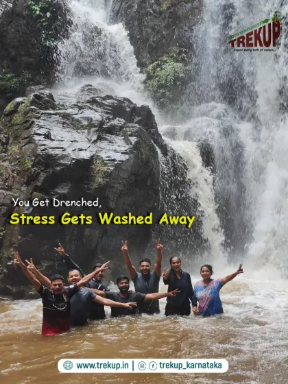 You get drenched, and the stress gets washed away. A group enjoying the refreshing water at the base of a waterfall on the Bandaje trek.