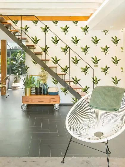 Our Wavy Banana Tree Wall Sticker adds a touch of the tropics to this modern staircase. The pattern creates a sense of movement and brings a fresh, natural element to the space.