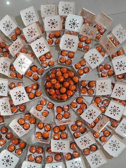 A large batch of my motichoor ladoo candles, arranged in a circle. These are perfect for bulk orders for Diwali or wedding favors.