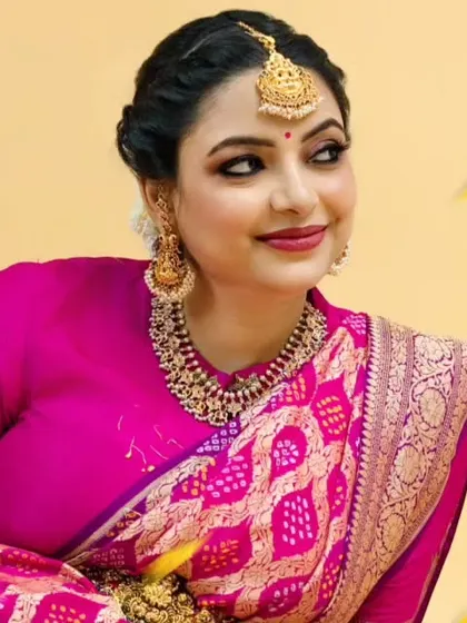 The winged eyeliner and temple jewellery complete this elegant festive look.
