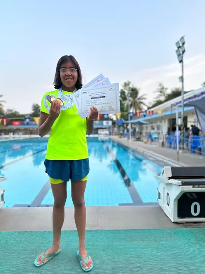 Prachita Deb stands proudly by the pool at Basavanagudi Aquatic Centre after winning one gold and two bronze medals at the Sub-Junior Meet.