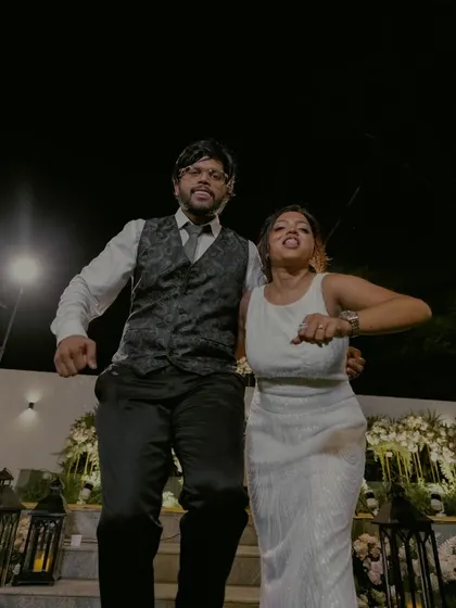 A candid shot of the couple dancing the night away, full of movement and happiness.