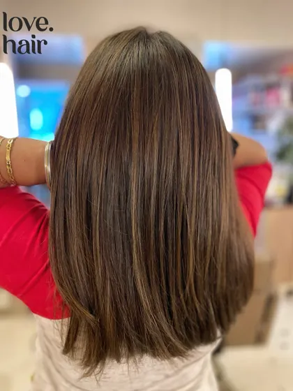 Another angle of the straight mushroom brown balayage, showing off the clean lines of the cut and the subtle, cool-toned highlights.