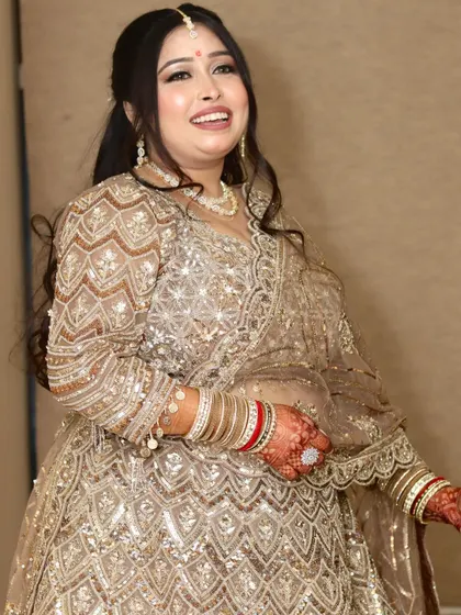 The perfect "Din Shagna Da" moment. A candid shot of the bride's happy smile, showcasing her glowing HD engagement makeup.