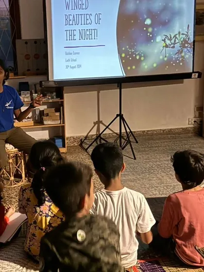 An expert gives a presentation on the "Winged Beauties of the Night," kicking off our magical evening dedicated to observing and learning about moths.