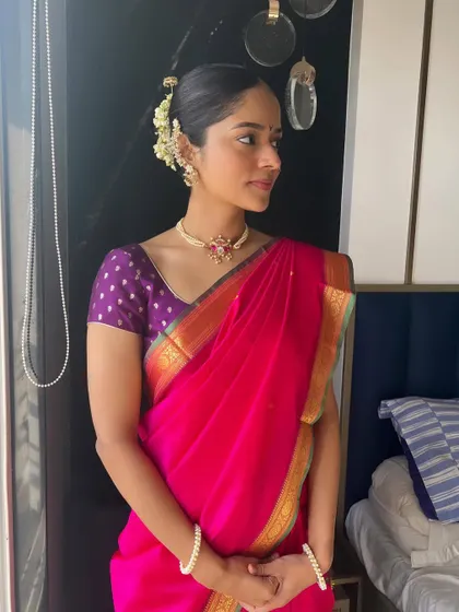 A portrait of the beautiful Maharashtrian bride, her hair styled in a classic, elegant updo.
