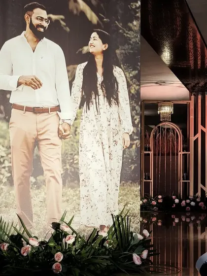 Making the decor all about the couple. A life-sized photo stands at the entrance, creating a warm and personal welcome for guests arriving at the reception.